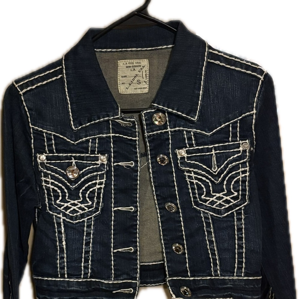 Women's LA Idol Denim Jacket with Thick White Stitching.